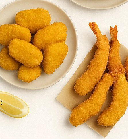 Breaded prawns and nuggets plated